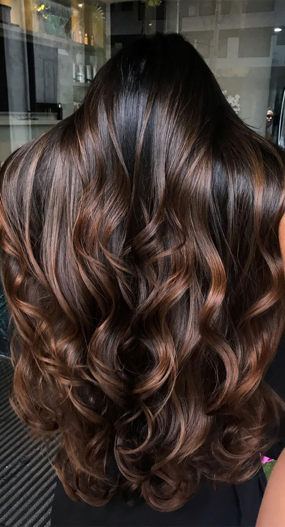 Dark chestnut brown hair with blunt ends