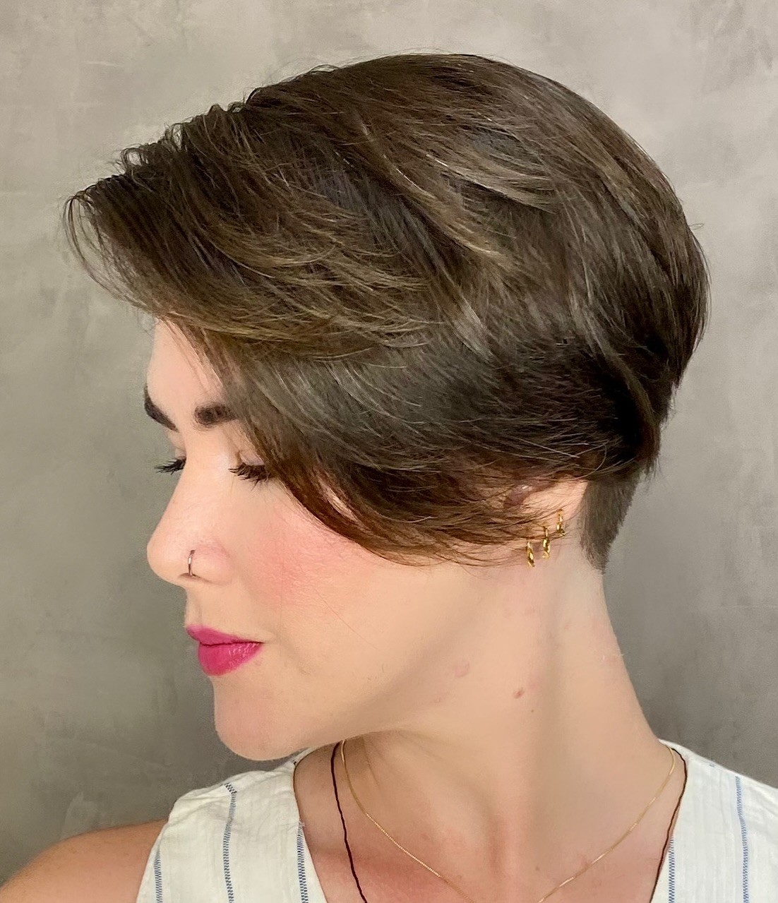 Side-swept pixie haircut with soft texture