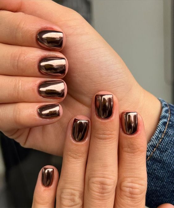 Short nails with metallic copper chrome polish, mirror finish