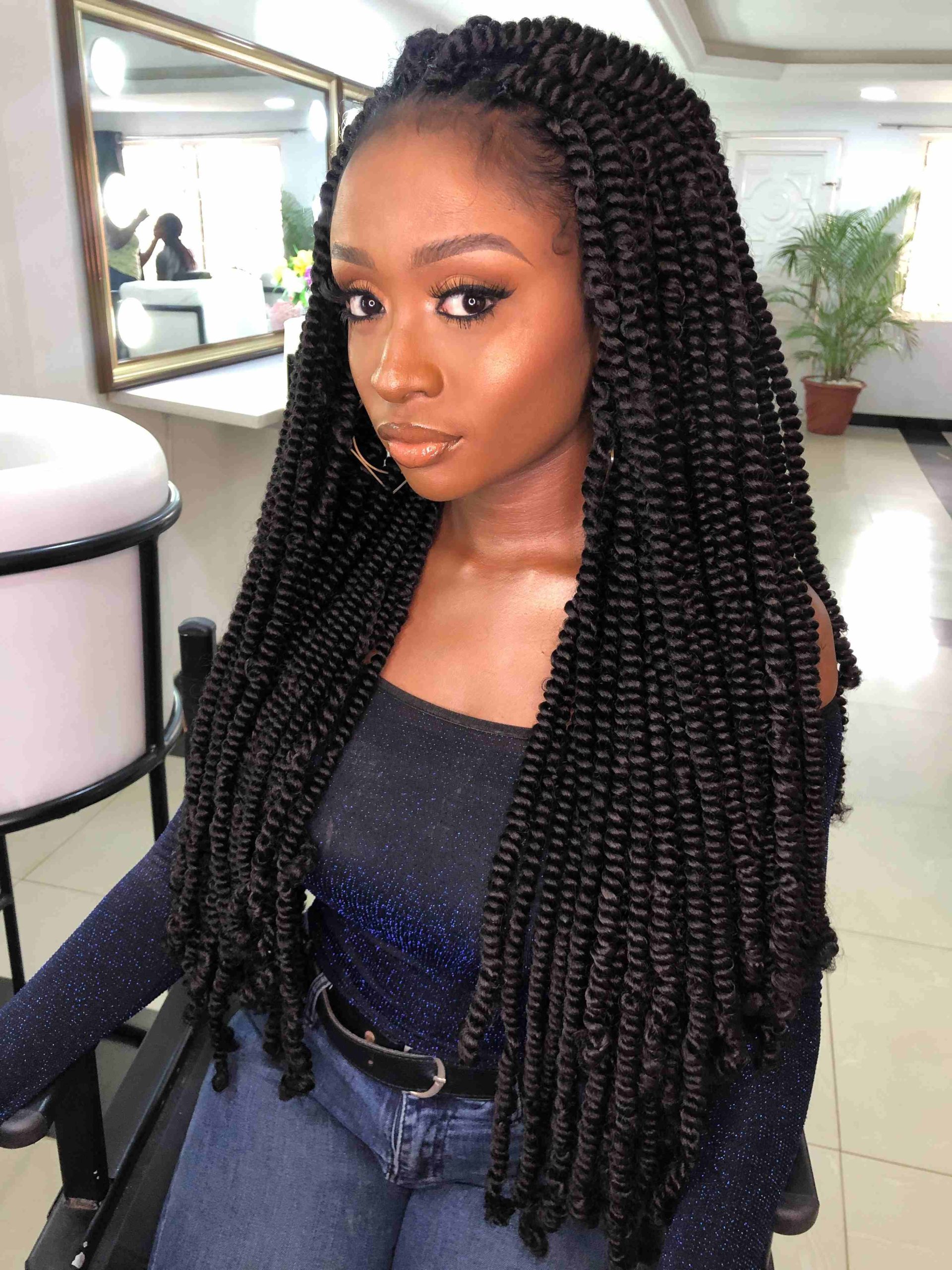 Very long black passion twists with a glossy springy texture