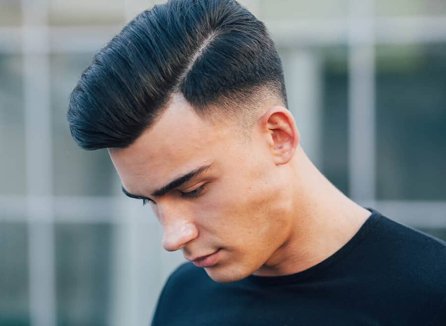 Comb over haircut with a low skin fade