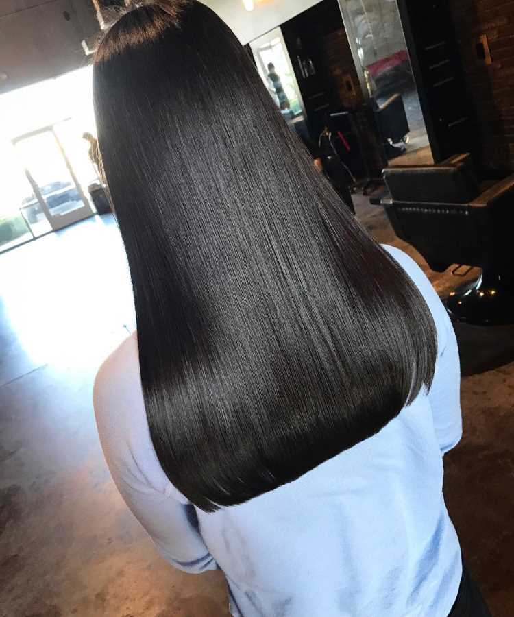 Long hair with a blunt perimeter and subtle hidden layers