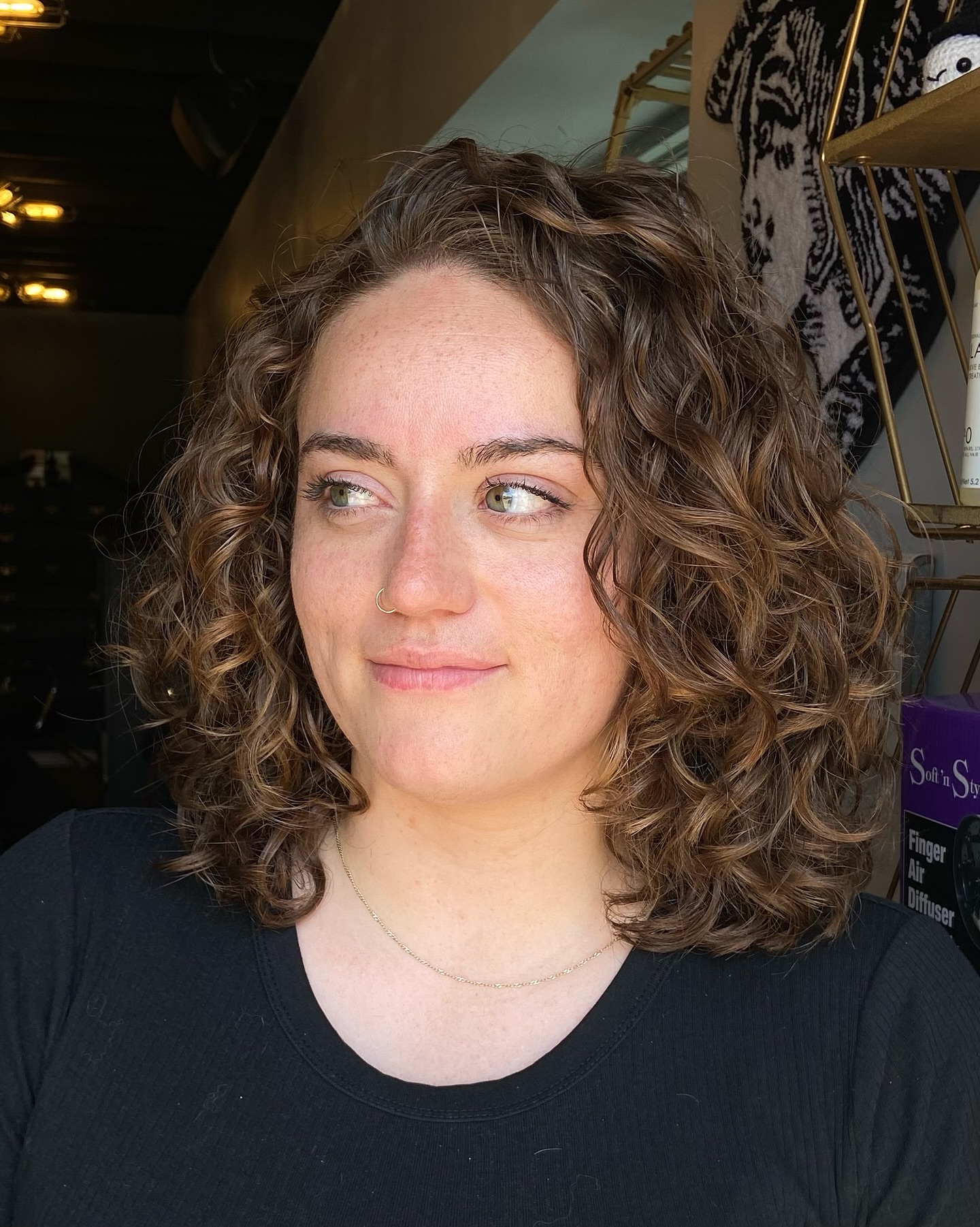 Curly shoulder-grazing Italian bob with interior graduation and root lift