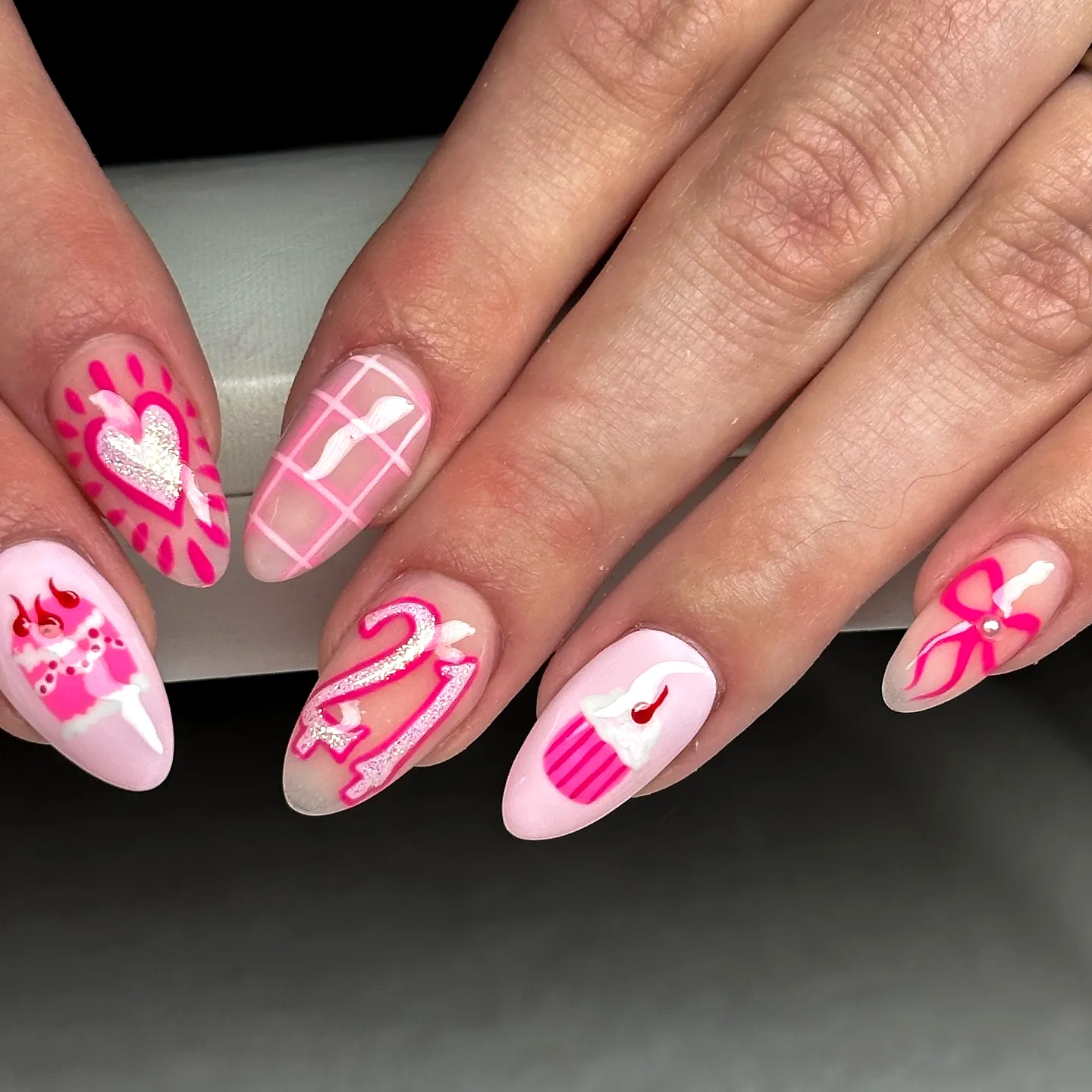 Pink birthday nails with cupcake and number art