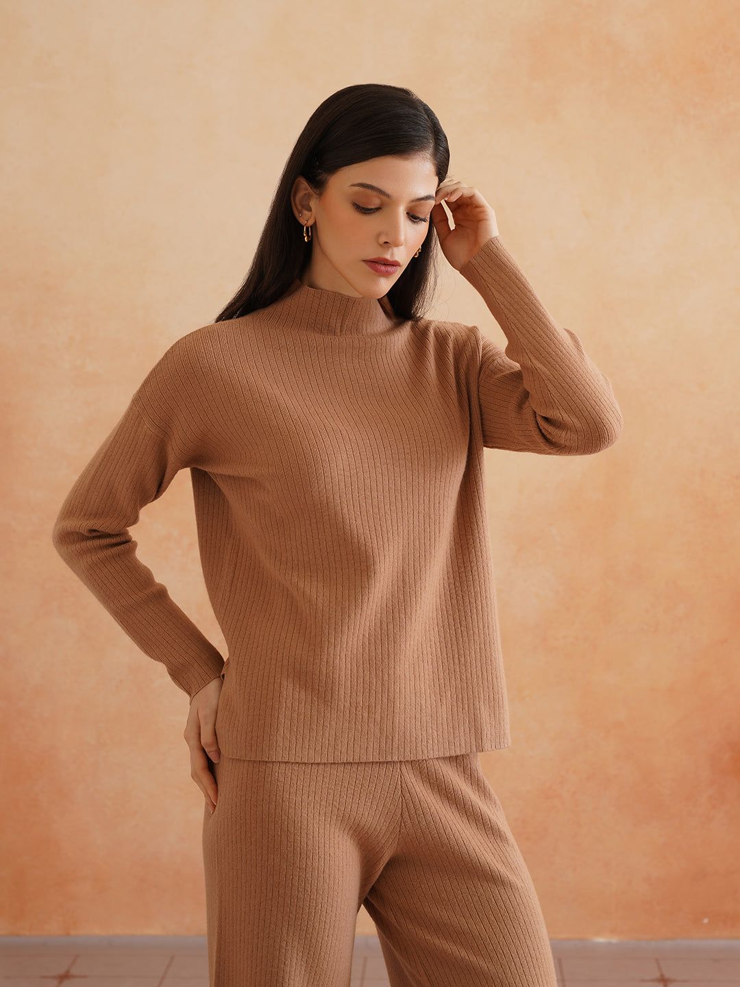 Woman wearing a brown two-piece knit co-ord set