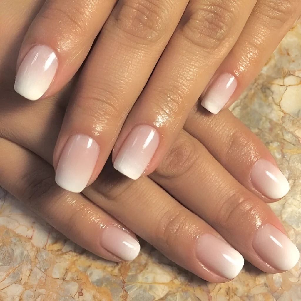 Square nails with a soft pink-to-white baby boomer ombre fade