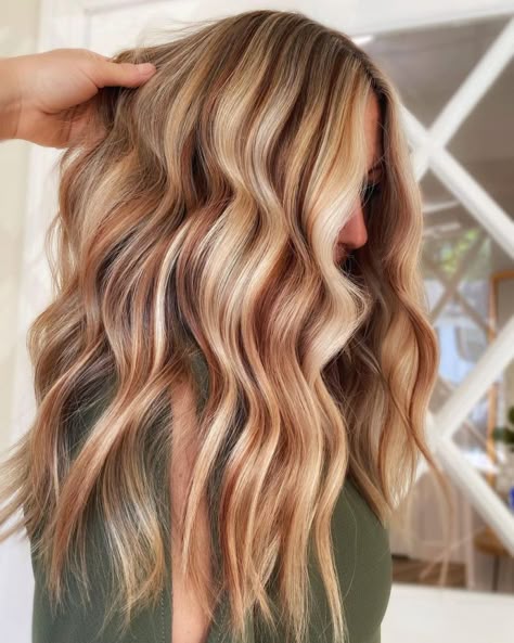 Subtle copper lowlights on blonde hair