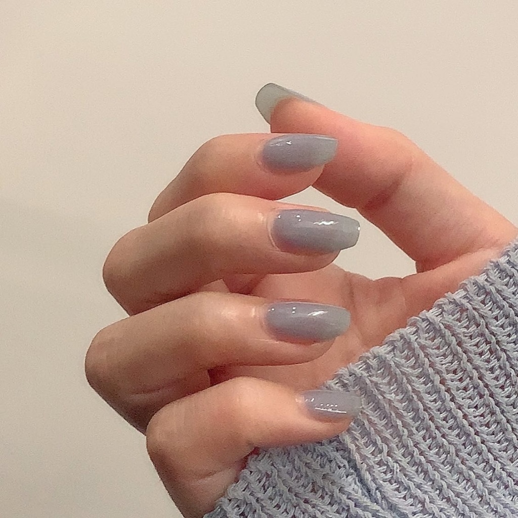 Short nails in a sheer misty gray polish