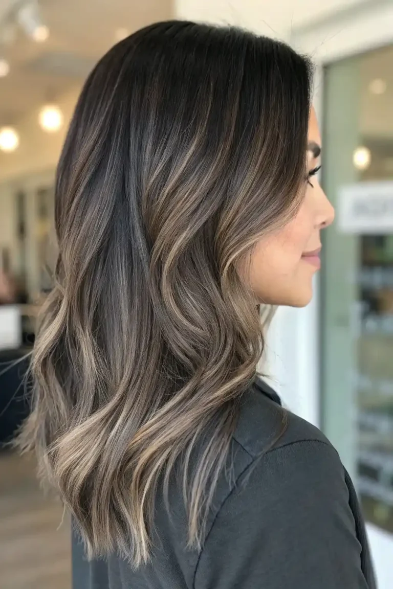 Medium length wavy hair with dark ash brown balayage