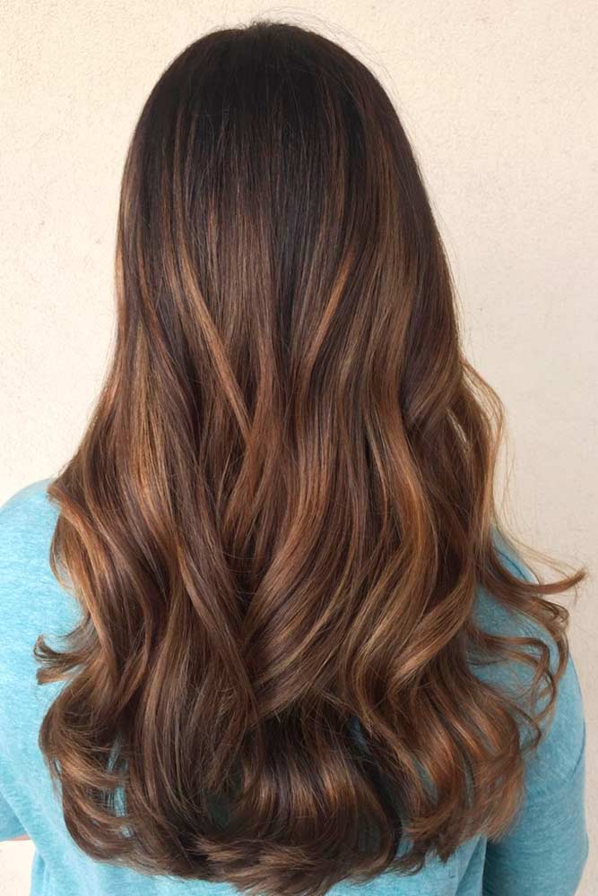 Back view of long wavy chocolate-brown hair melting to warm mocha-caramel ends