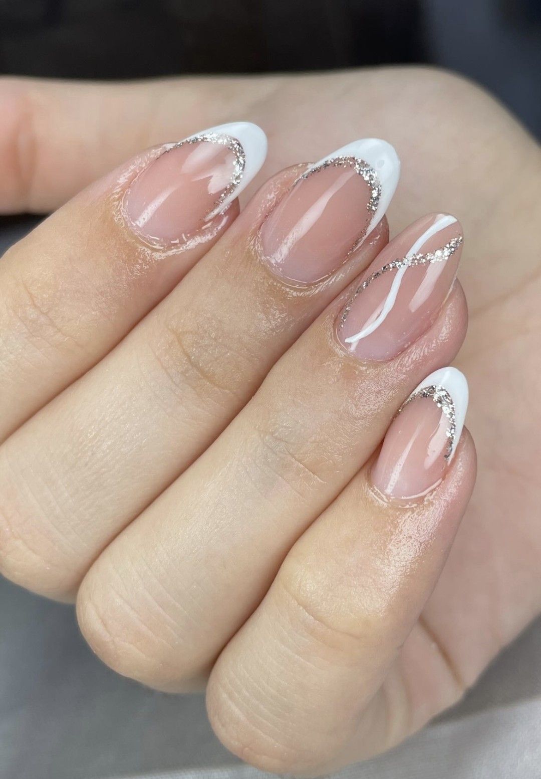 White French tip nails with a silver glitter line accent