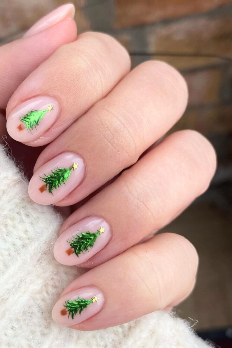 Sheer blush nails with tiny green Christmas tree art