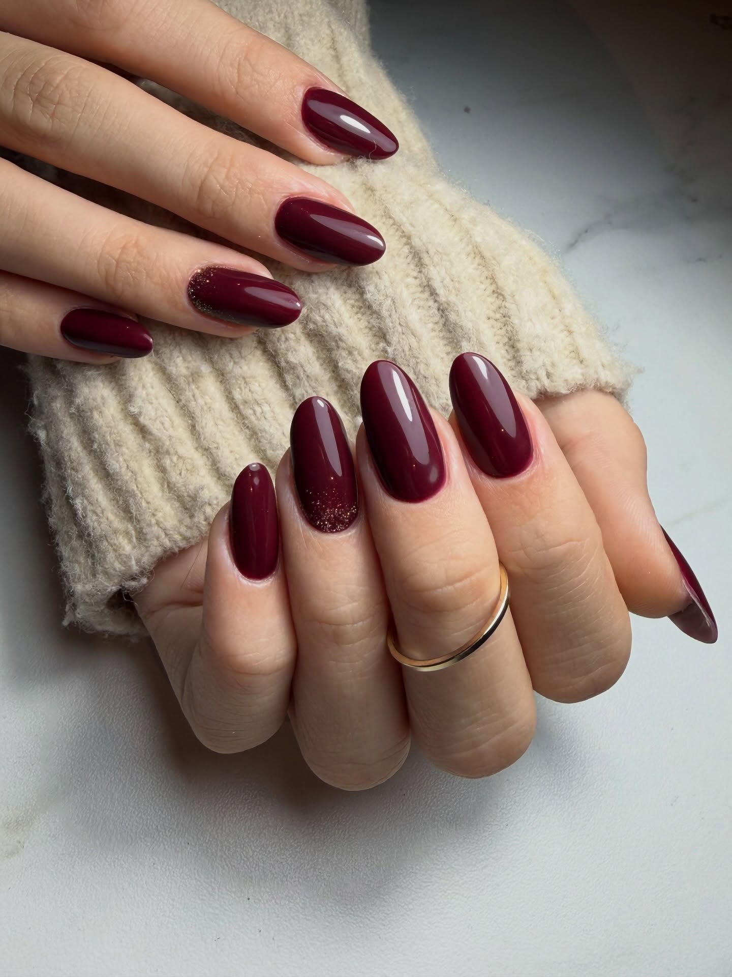 Almond cranberry nails with glitter finish