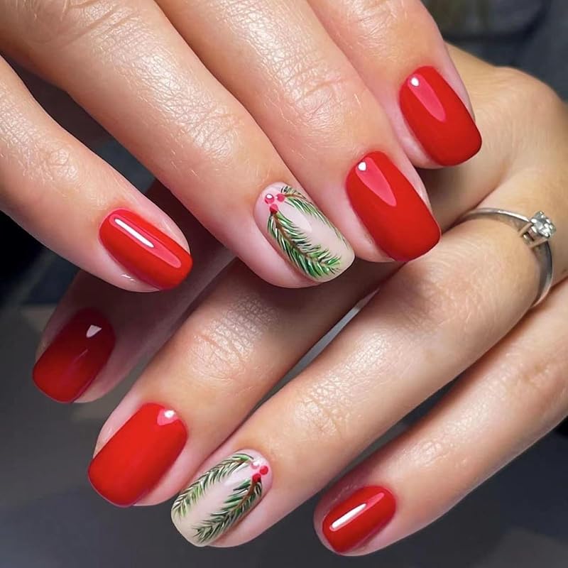 Short square nails in glossy crimson red with pine branch and berry accent nails
