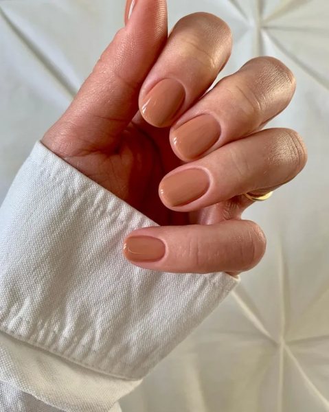 Short nails in warm caramel nude polish