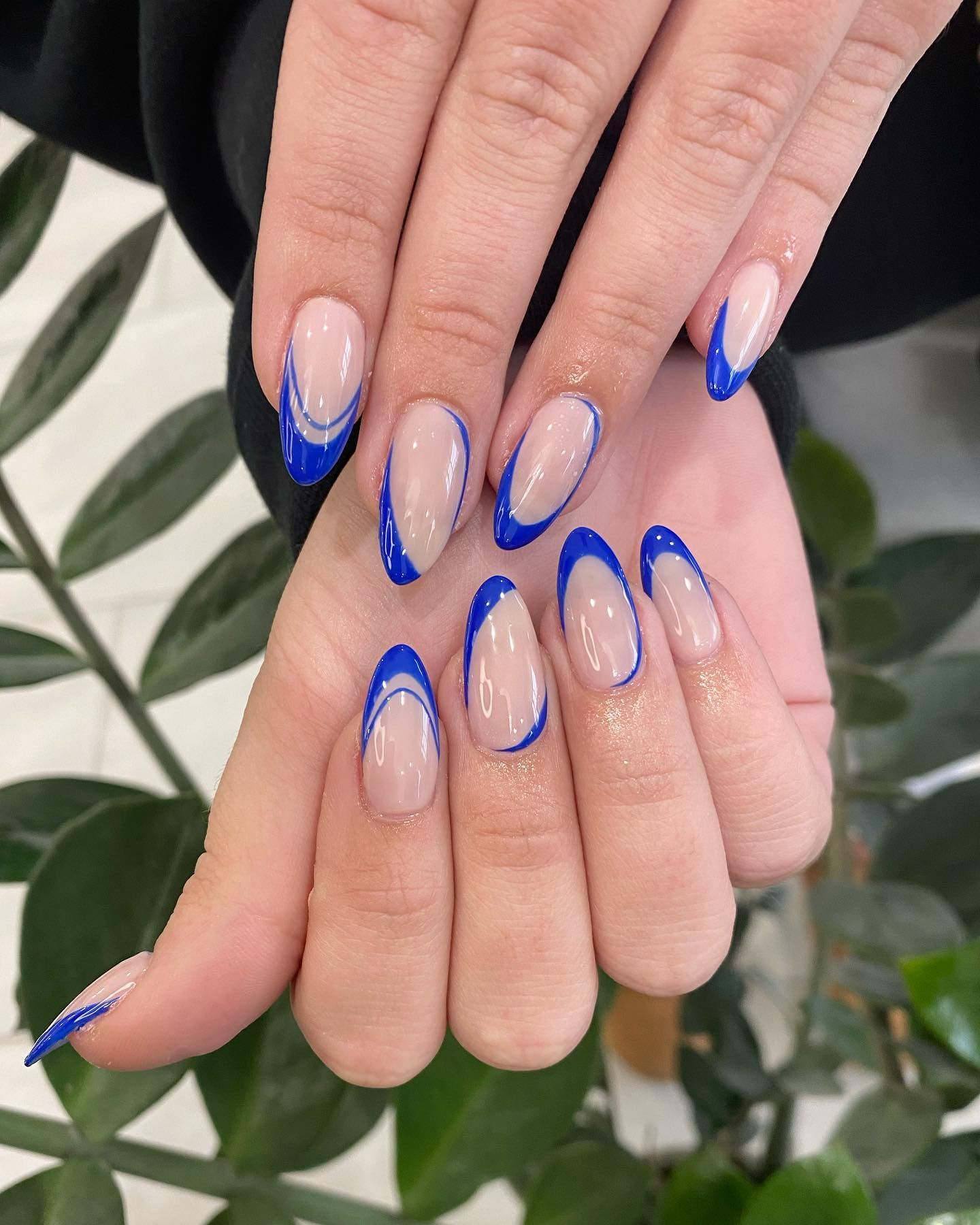 Almond nails with ice blue french tips