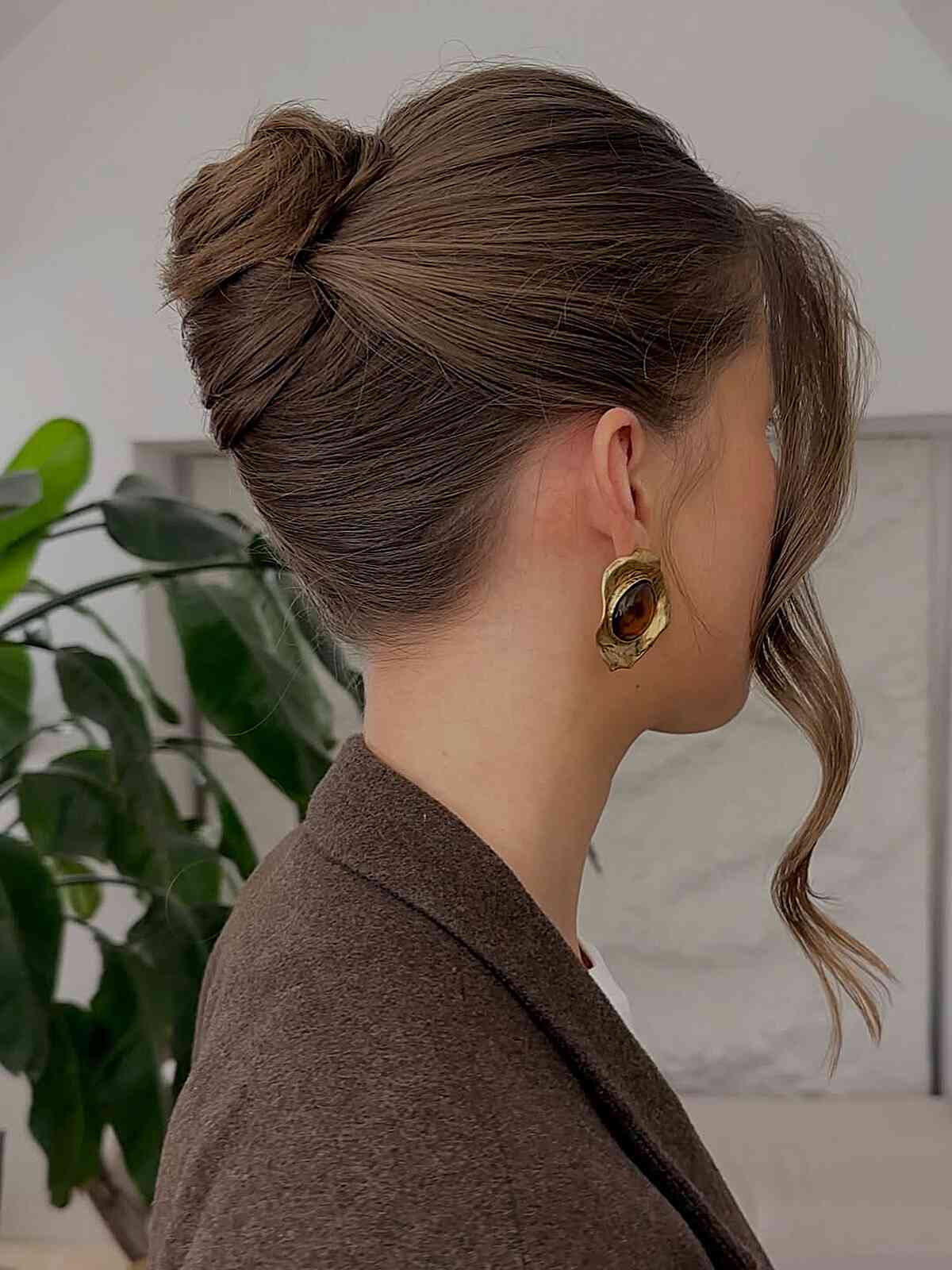 Neat classic French twist updo with smooth polished surface
