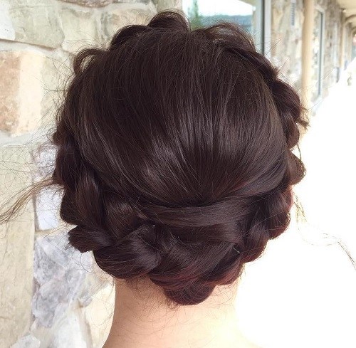 Chunky braid wrapped across the crown of the head, milkmaid style