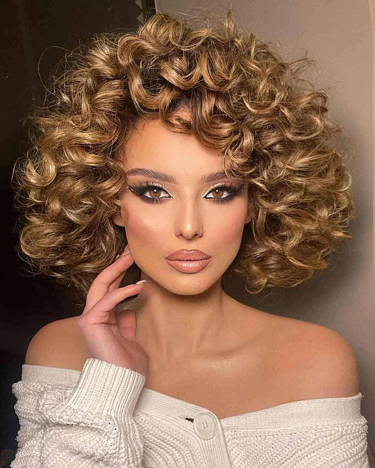 Woman with a voluminous blonde curly bob haircut