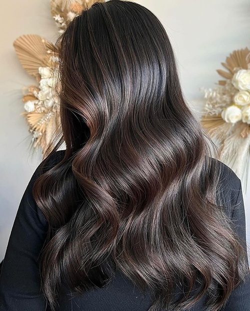 Glossy espresso brown on long wavy hair, back view