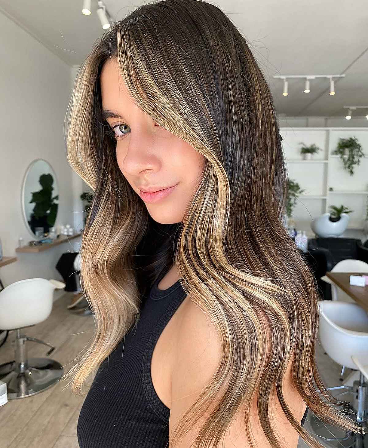 Money-piece highlights on dark hair