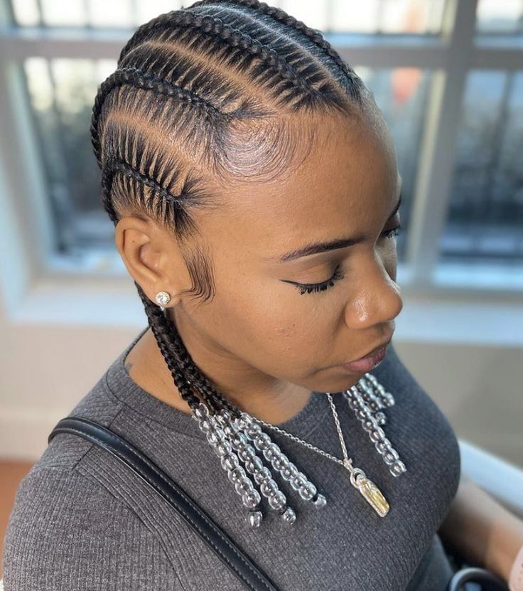 Woman with feed-in braids finished with beads at the ends