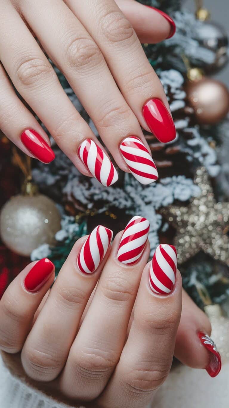 Candy cane striped nails with red and white diagonal stripes and solid red accent nails
