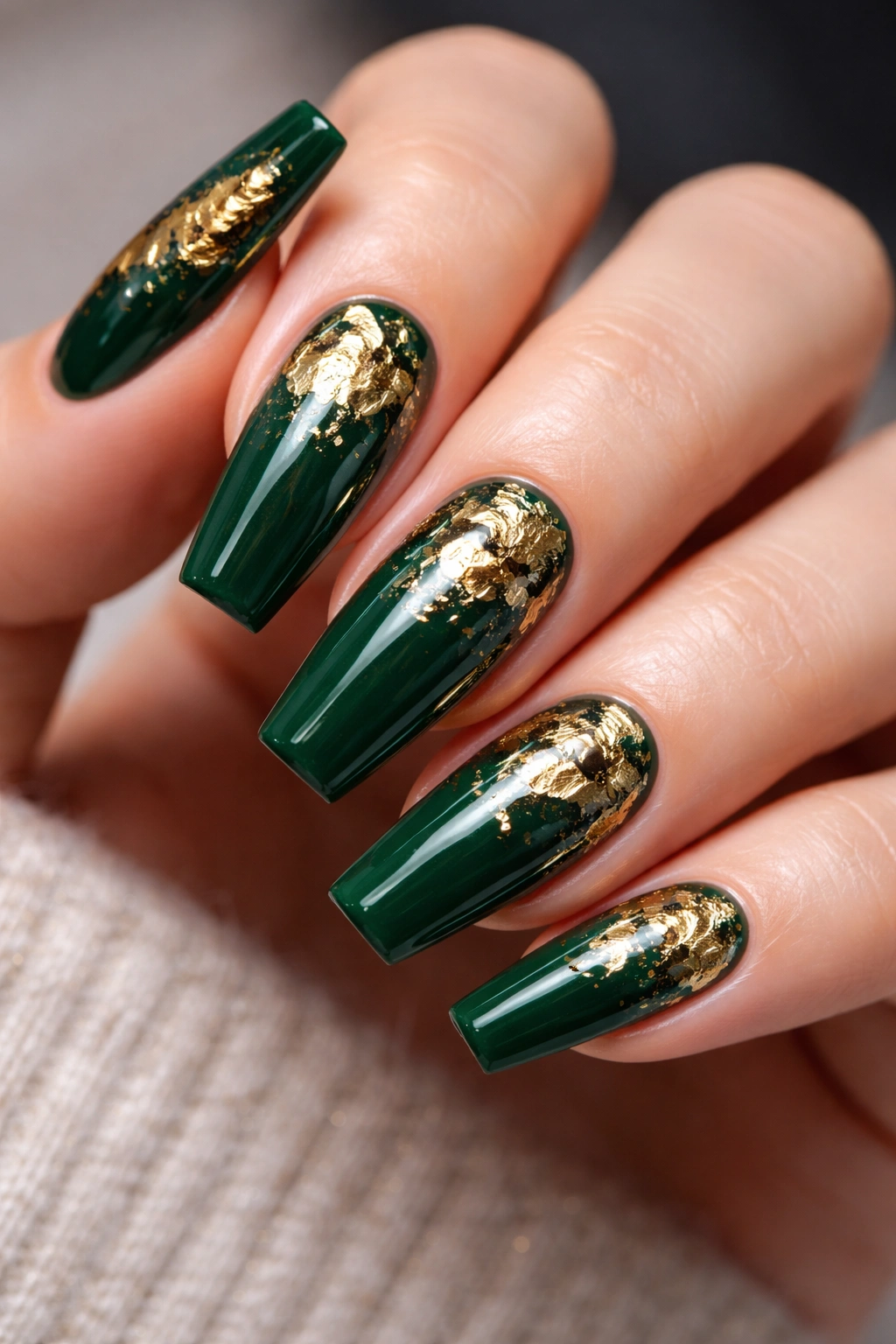 Dark green nails with gold foil accents