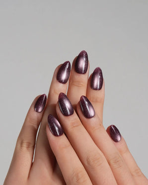 Plum cat-eye press-on nails with a magnetic shimmer stripe