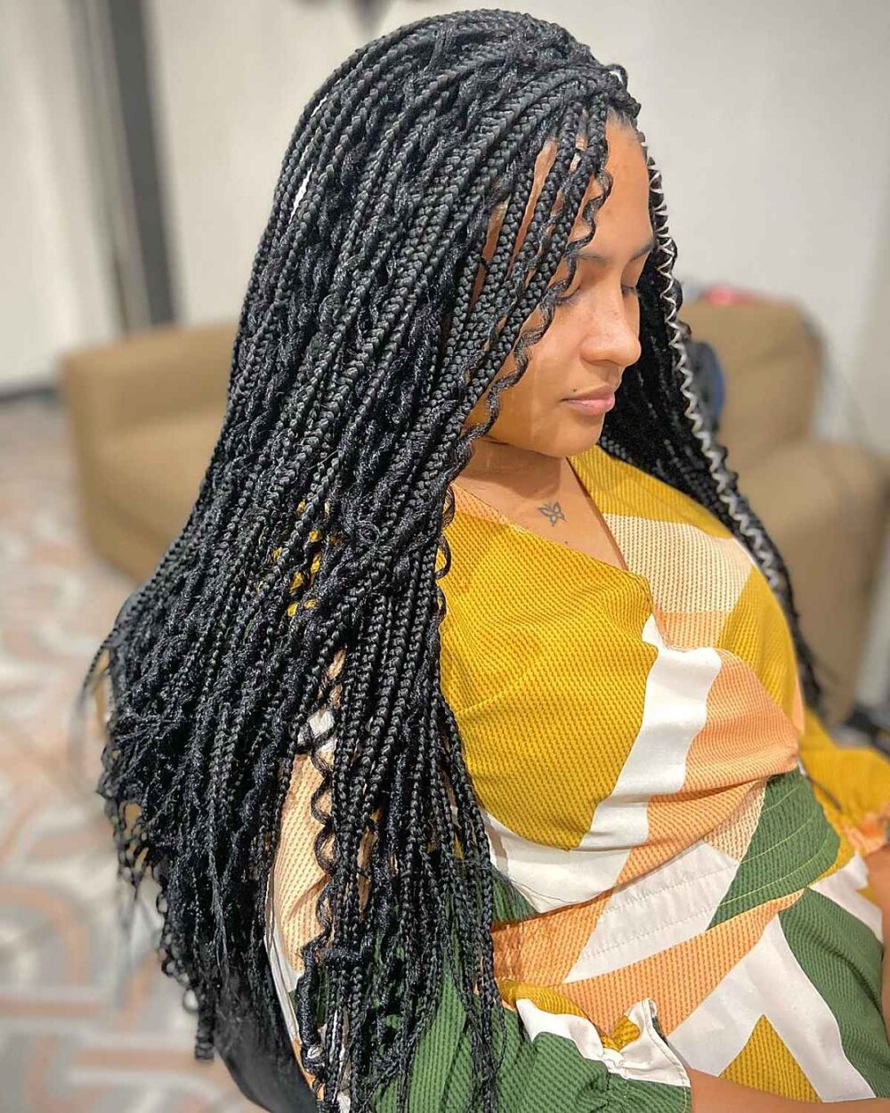 Thick goddess braids finished with flowing curly ends
