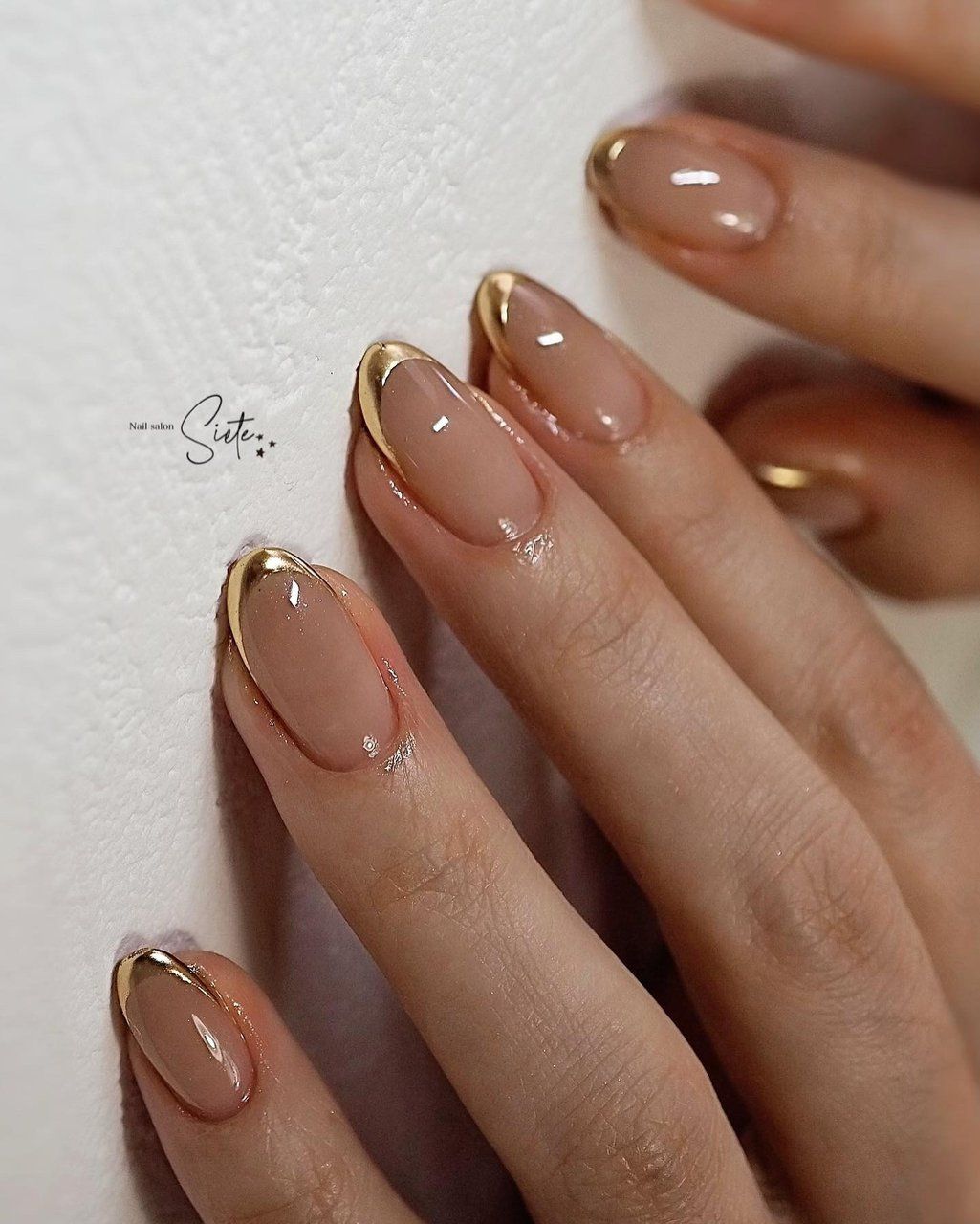 French manicure with metallic gold tips