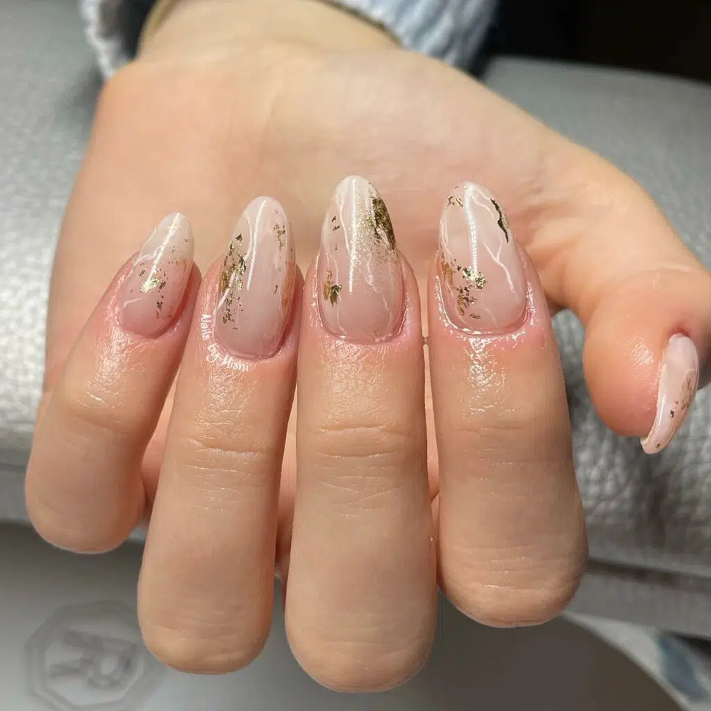 Nude marble nails with delicate gold vein detailing