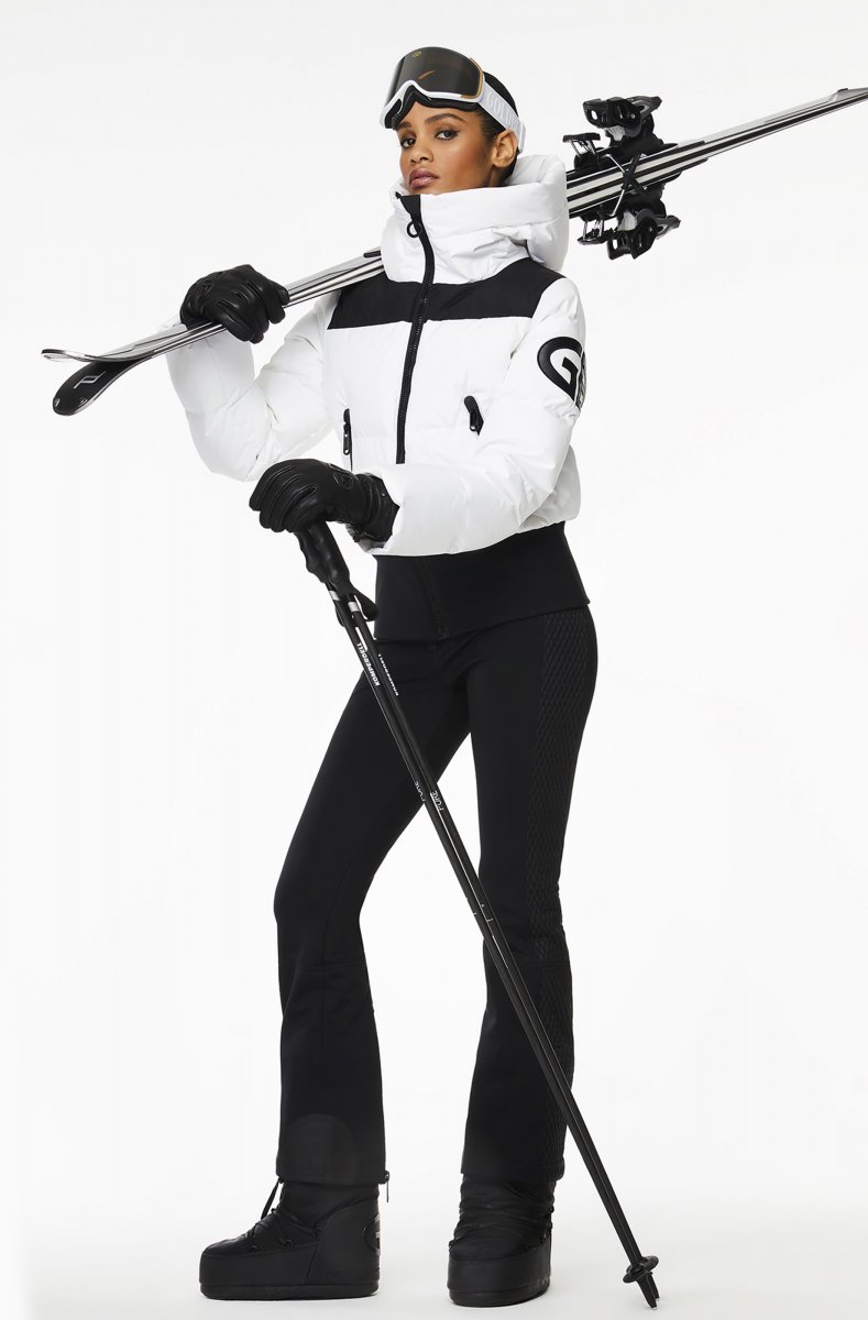 Product photo of black ski pants with gold zipper details
