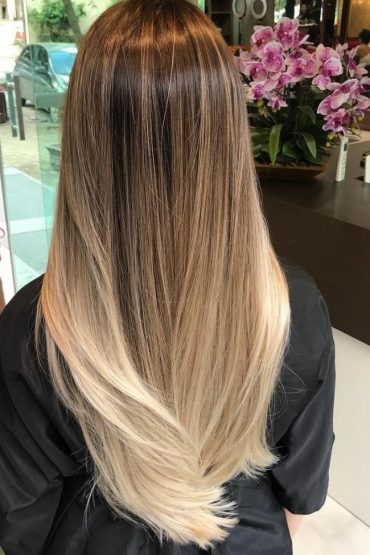 Golden blonde balayage on long straight hair
