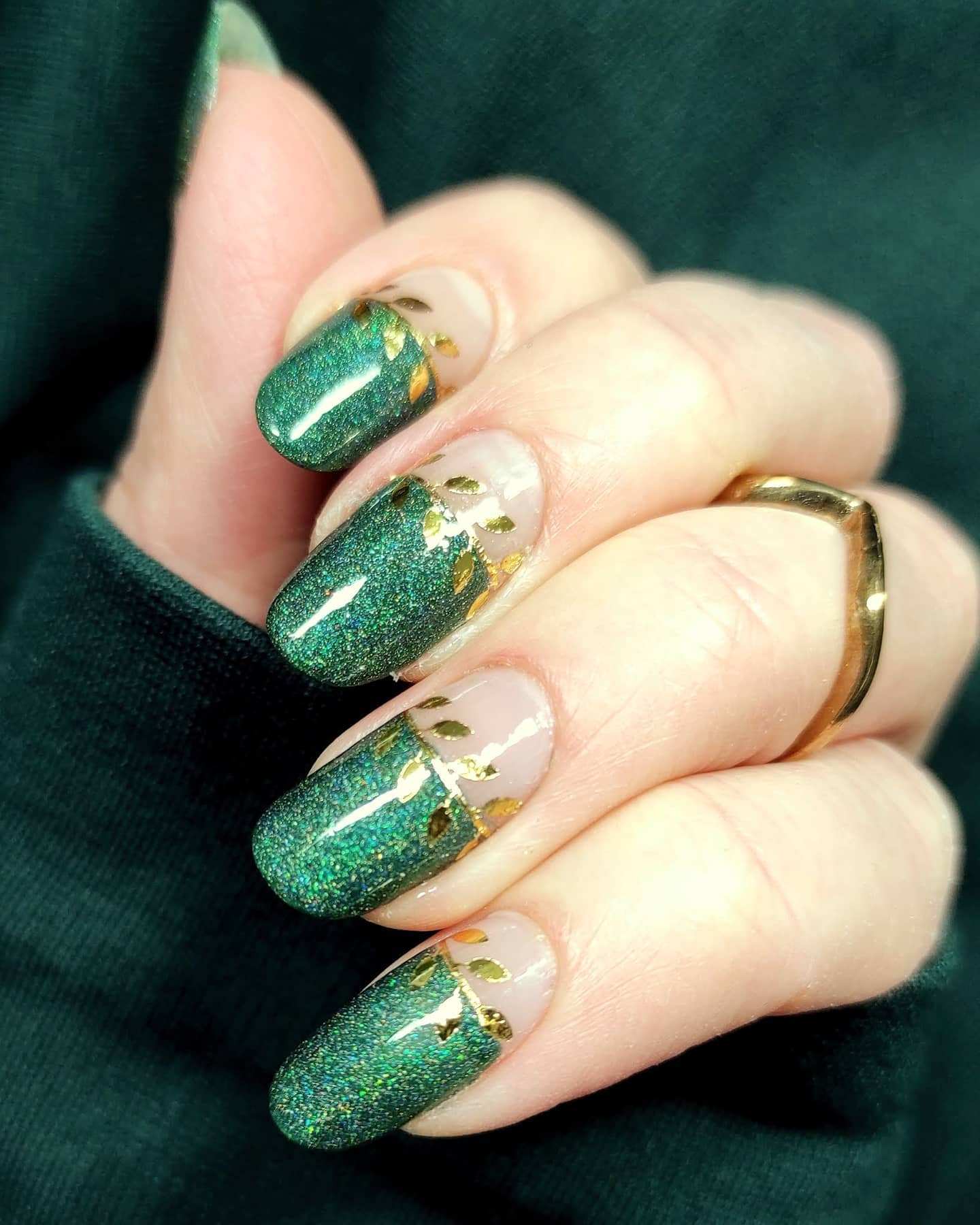 Forest green nails with gold foil flakes