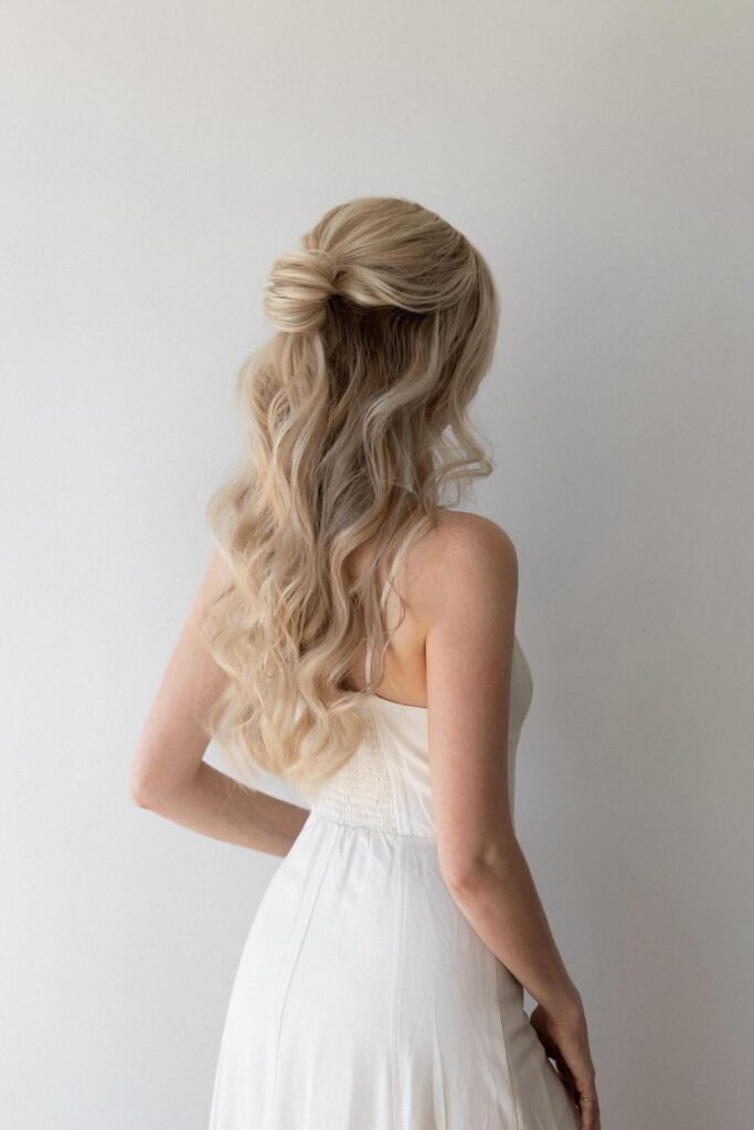 Twisted half-up ponytail with soft waves