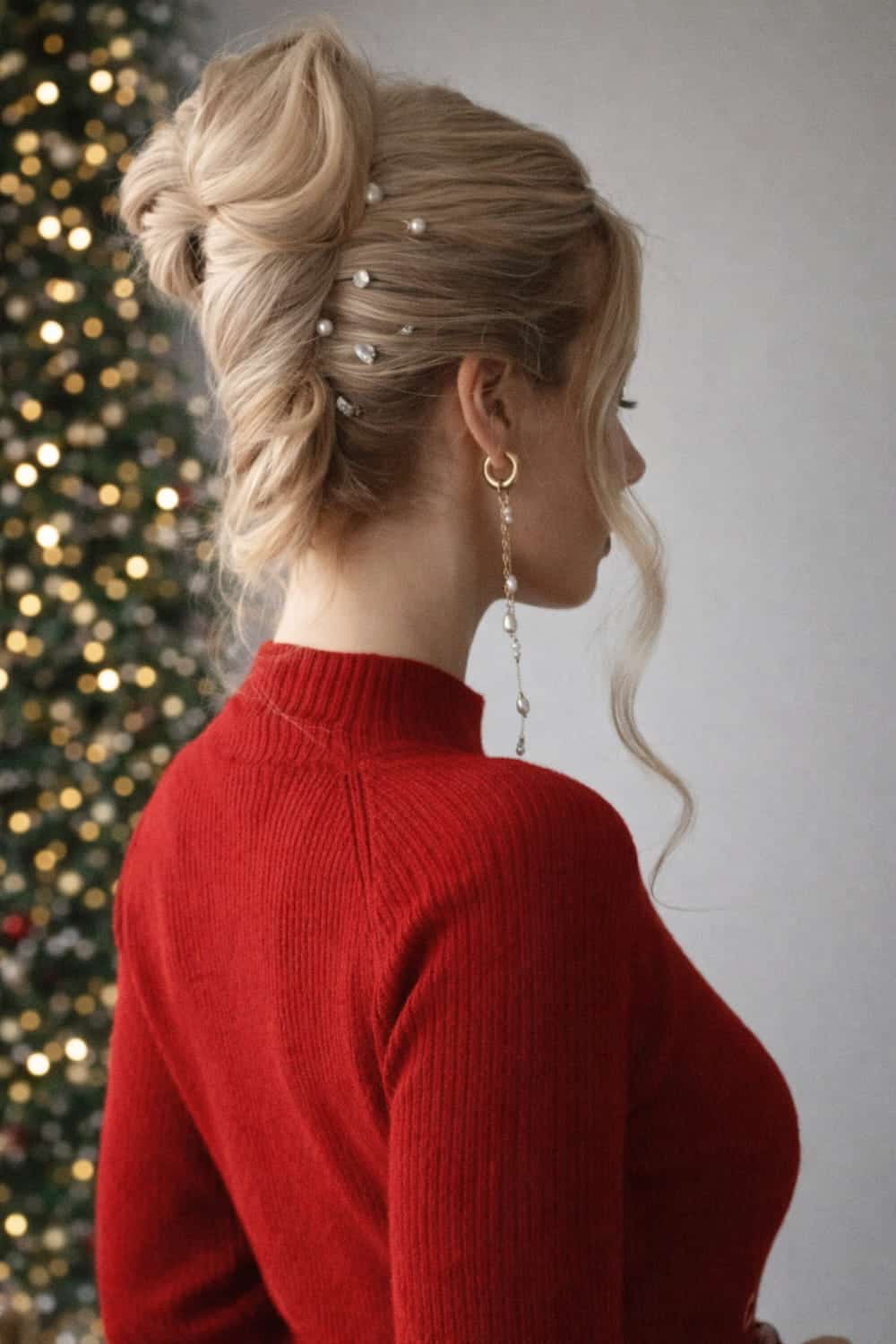Loose textured twisted updo with tiny pearl pins scattered through the sides