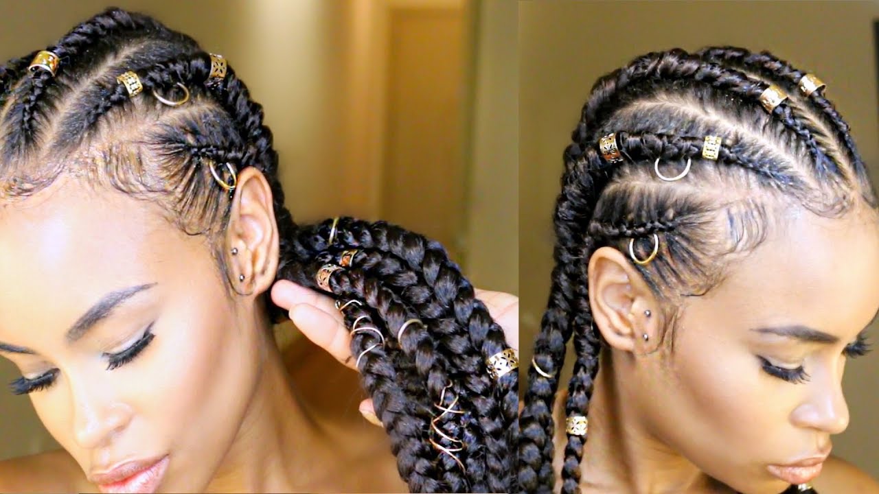 Woman with cornrow feed-in braids styled with gold cuffs