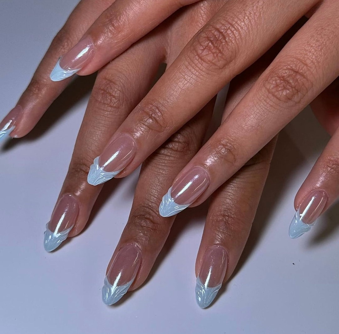 Icy blue 3D French tip press-on nails in frosty light blue
