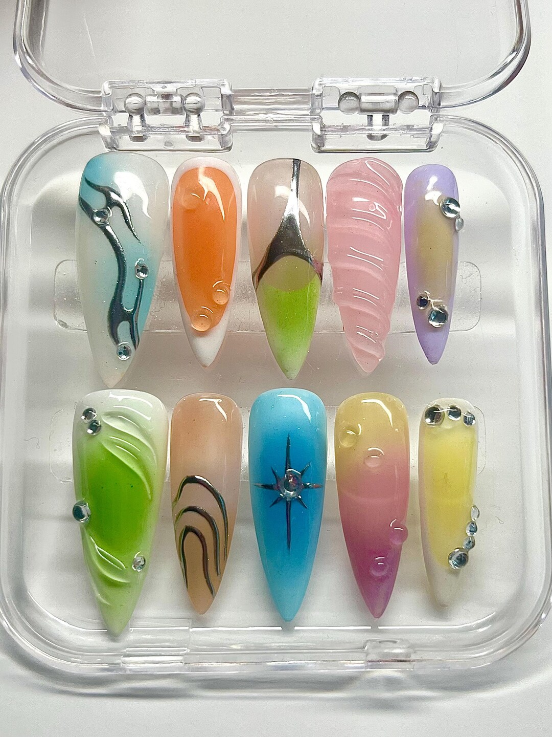 Silver chrome aura nails with a metallic center glow