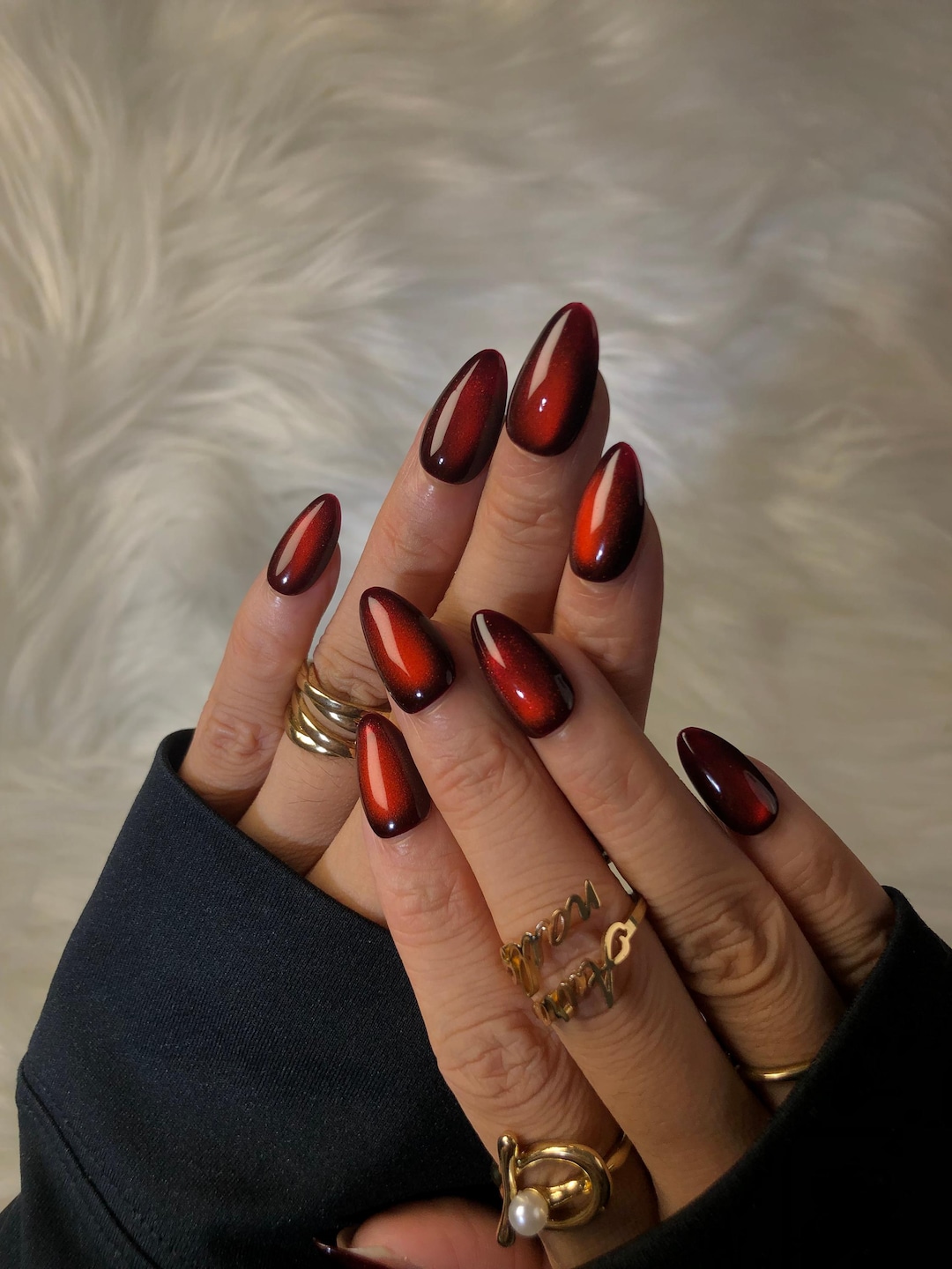 Burgundy wine cat eye nails on long almond shape