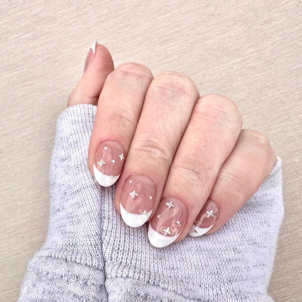 White French tips with silver star and dot accents