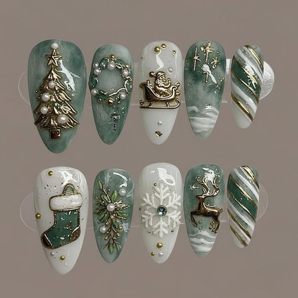 Almond press-on nails in sage marble and white with 3D gold Christmas charms and pearls