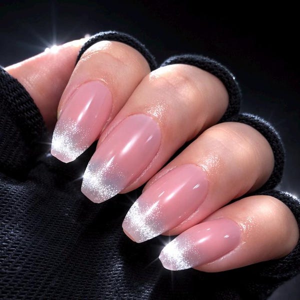 Blush pink almond nails with silver glitter fade tips