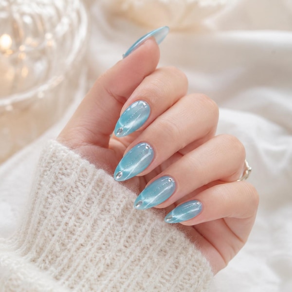 Icy light blue cat eye nails