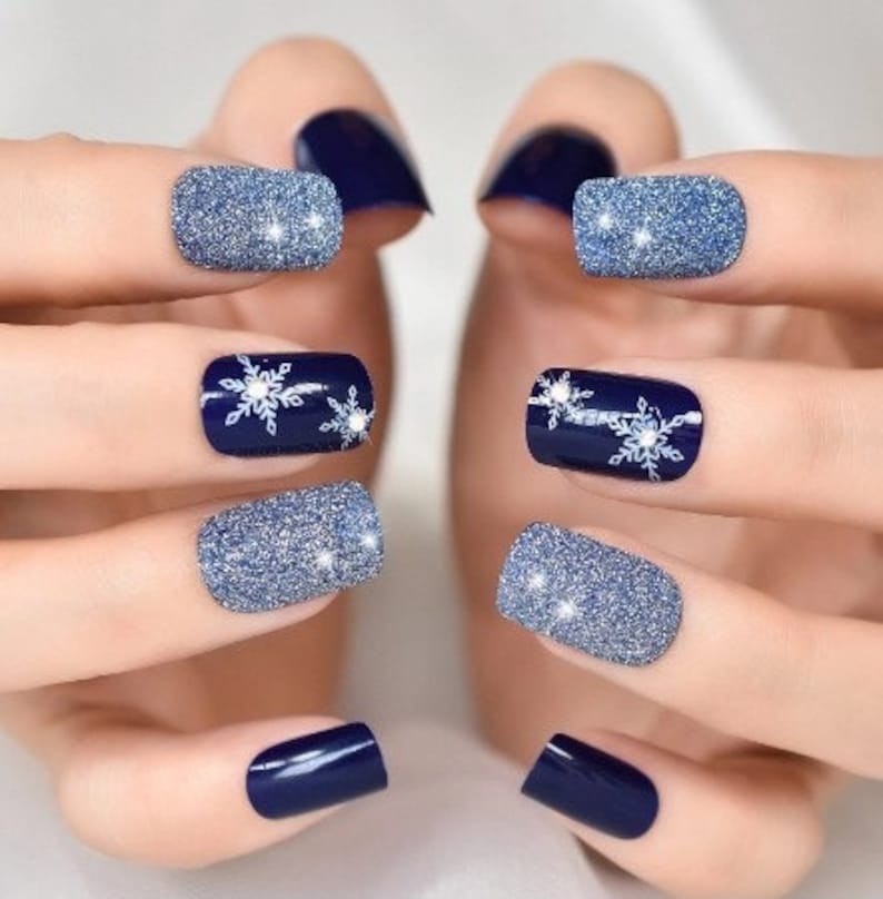 Short navy glitter Christmas press-on nails with snowflake art