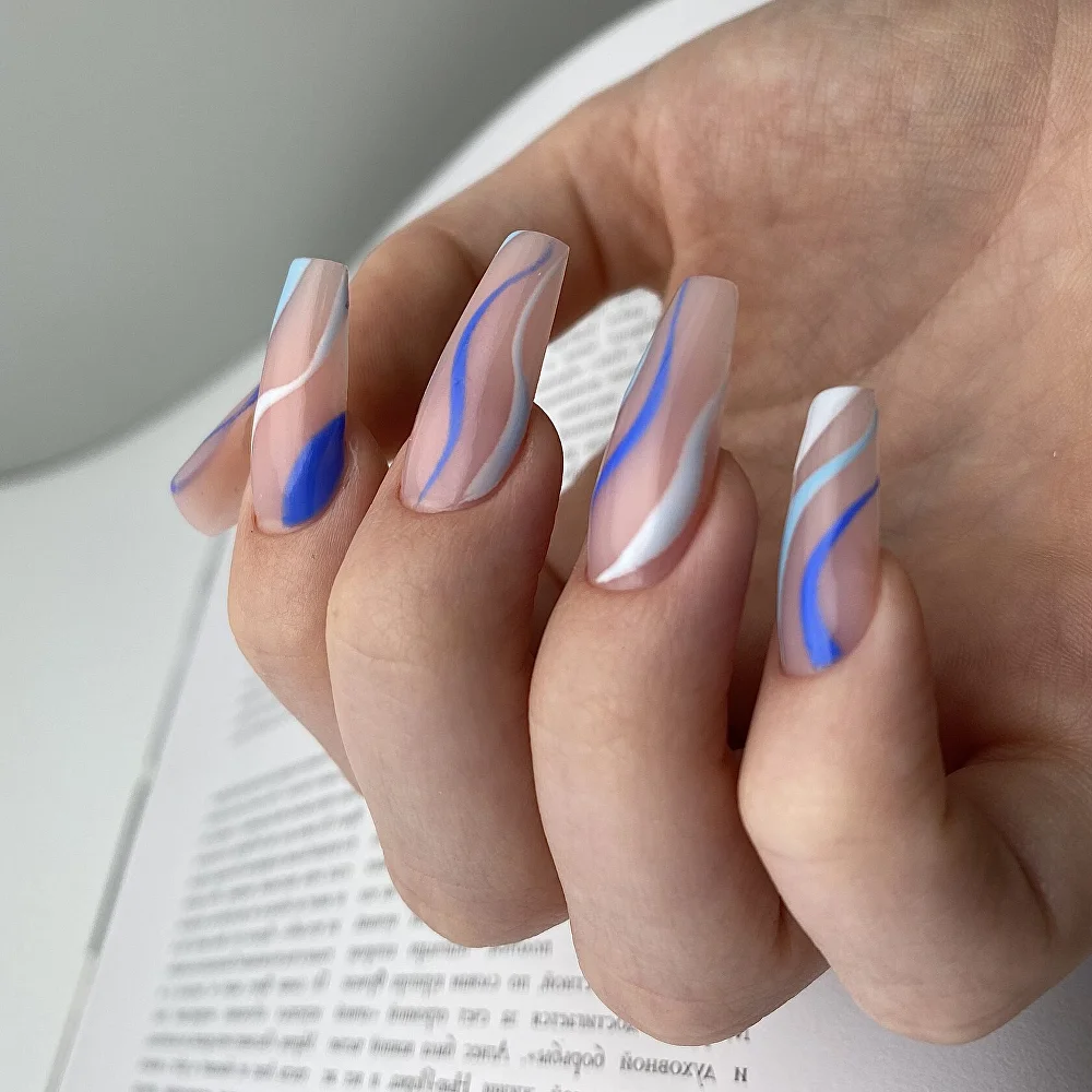 Short oval nails with white and blue abstract swirl art