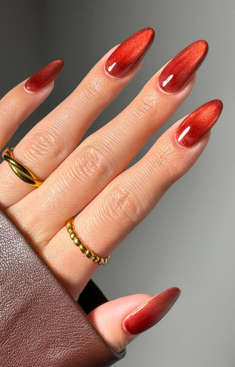 Short almond nails in glossy ruby red chrome gel