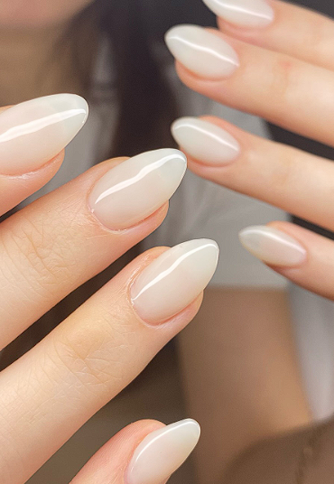 Almond nails in milky sheer white polish