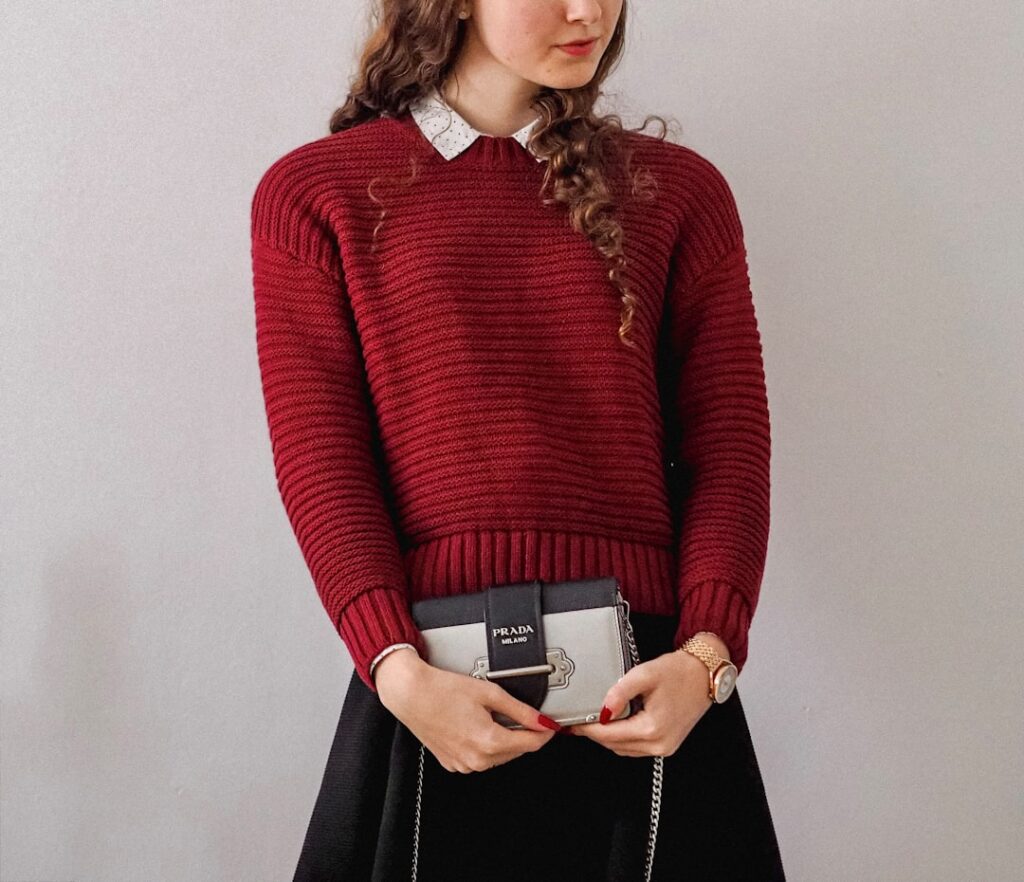 Burgundy sweater styled in a winter outfit